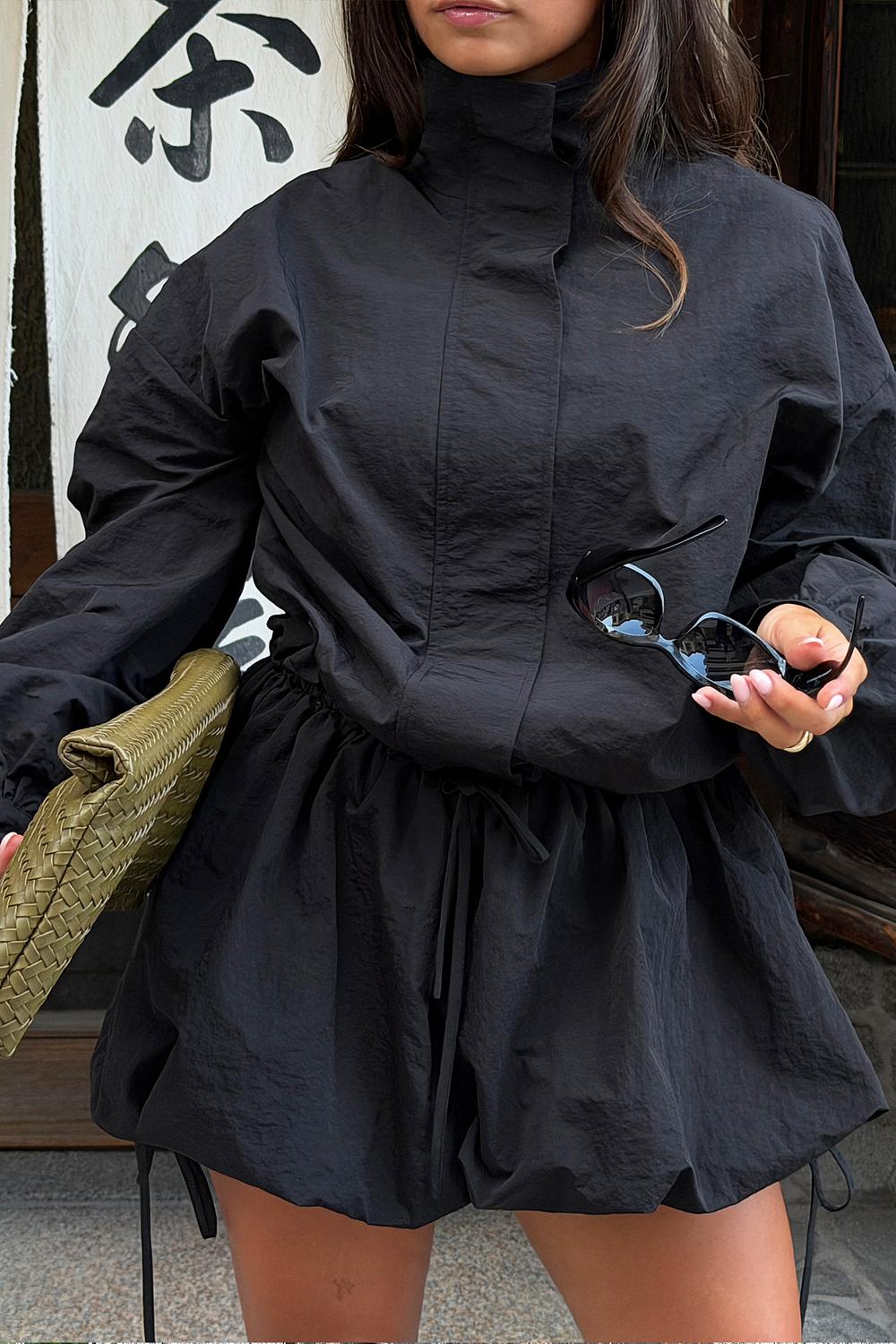 Black playsuit with balloon skirt