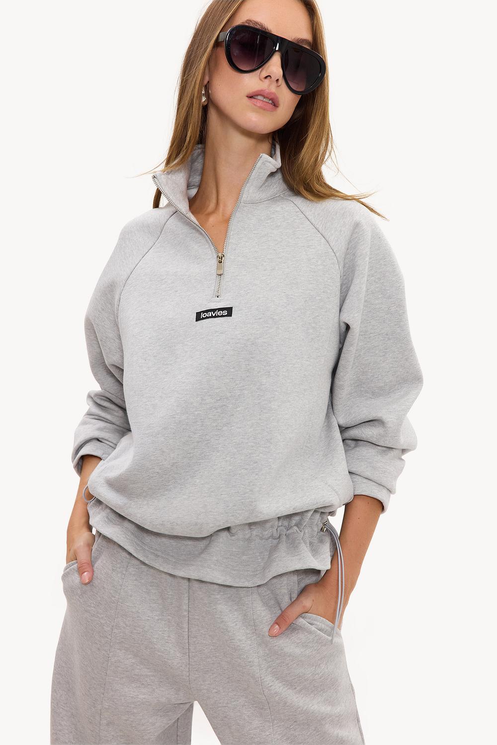 Gray zip-up sweater with black logo