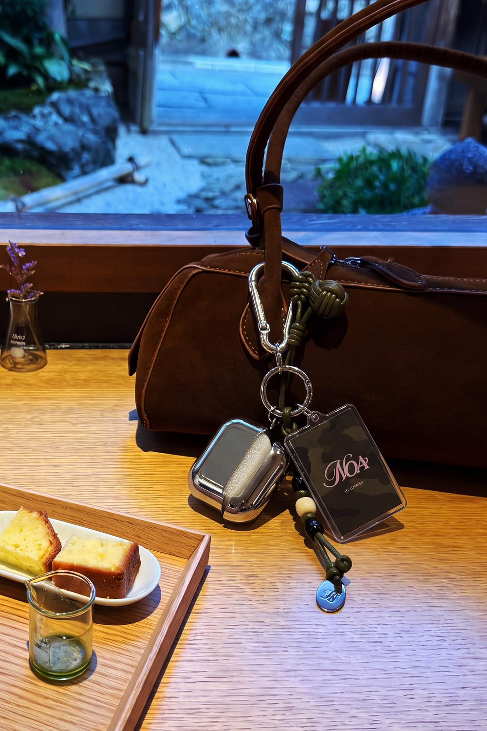 Bag charm with AirPods case