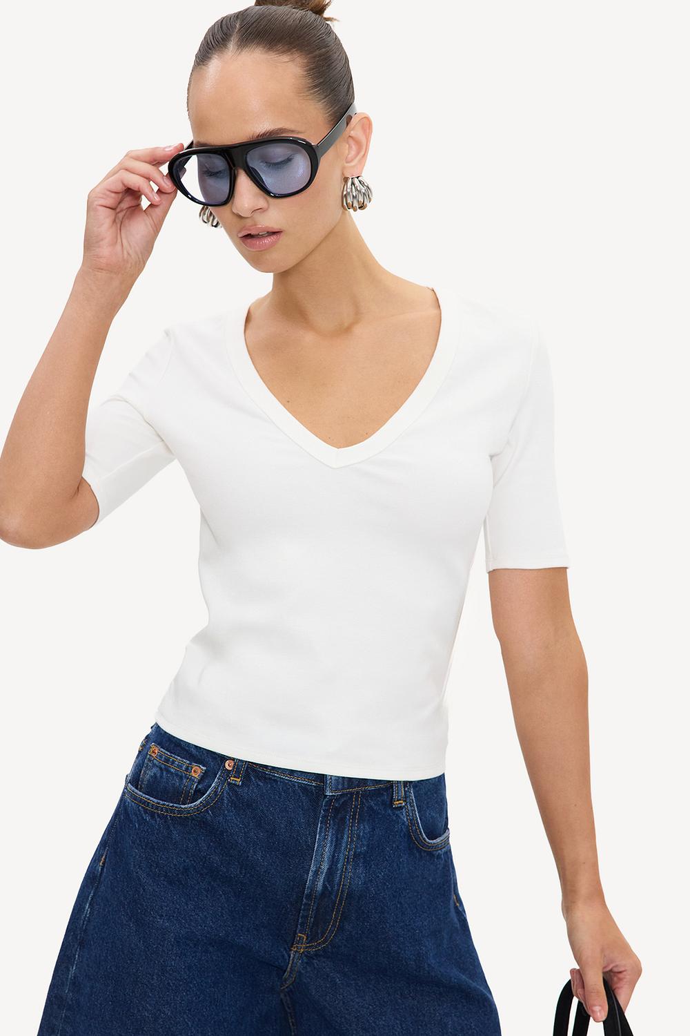 White V-neck top