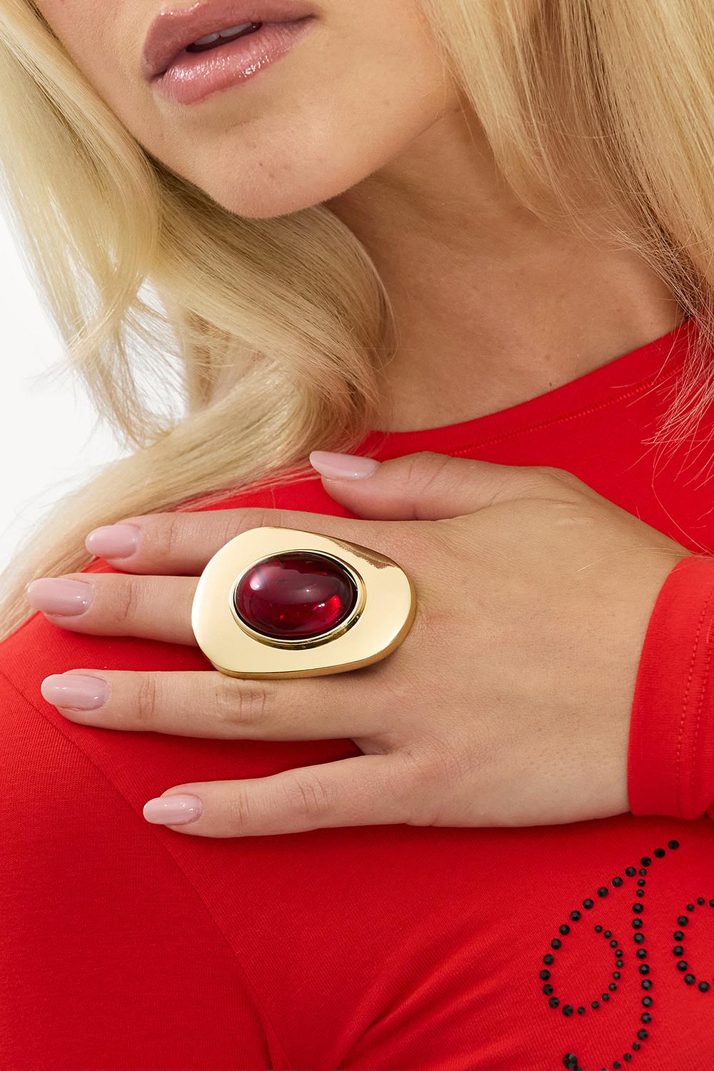 Gold statement ring with red detail