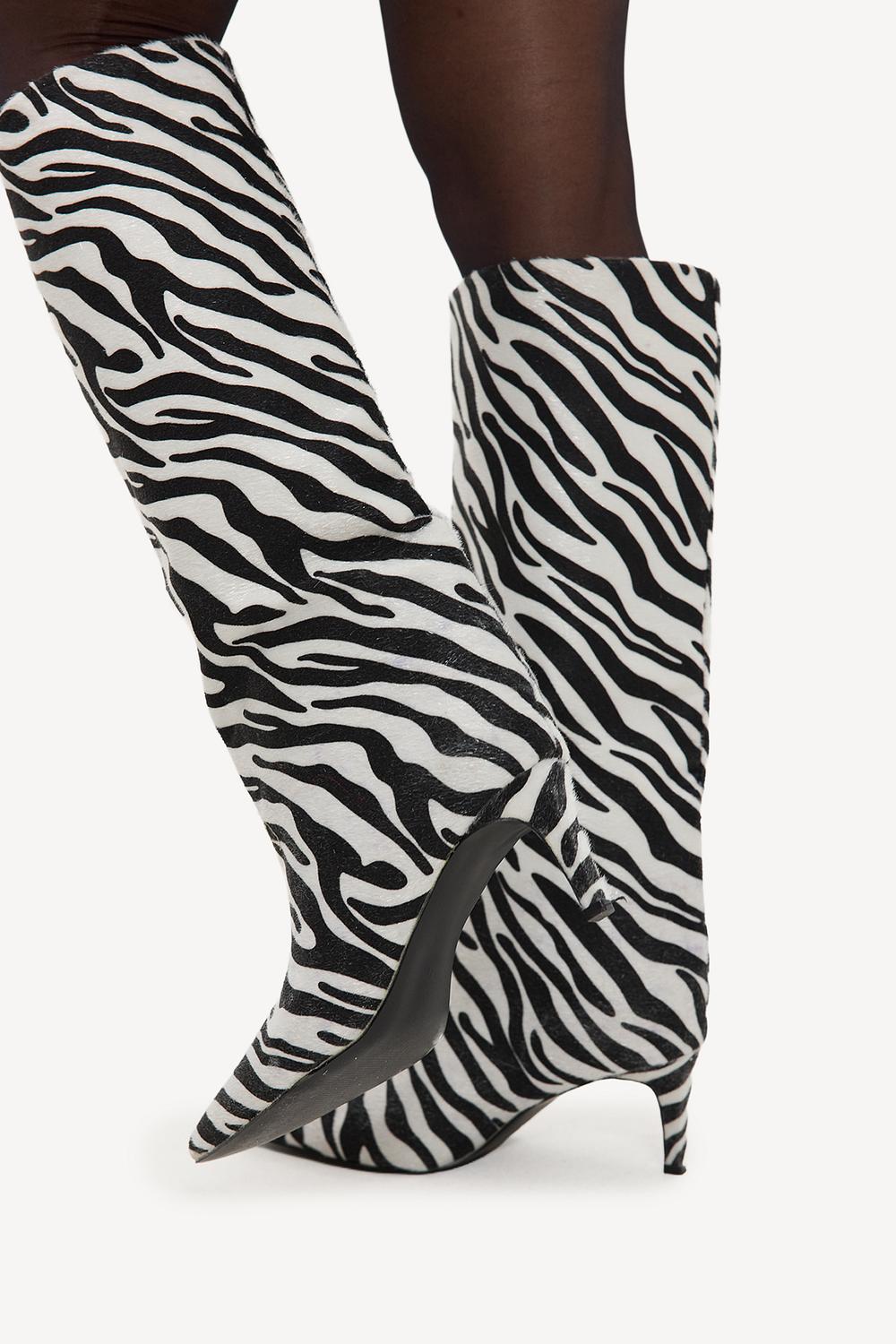 Black zebra-print boots with heels